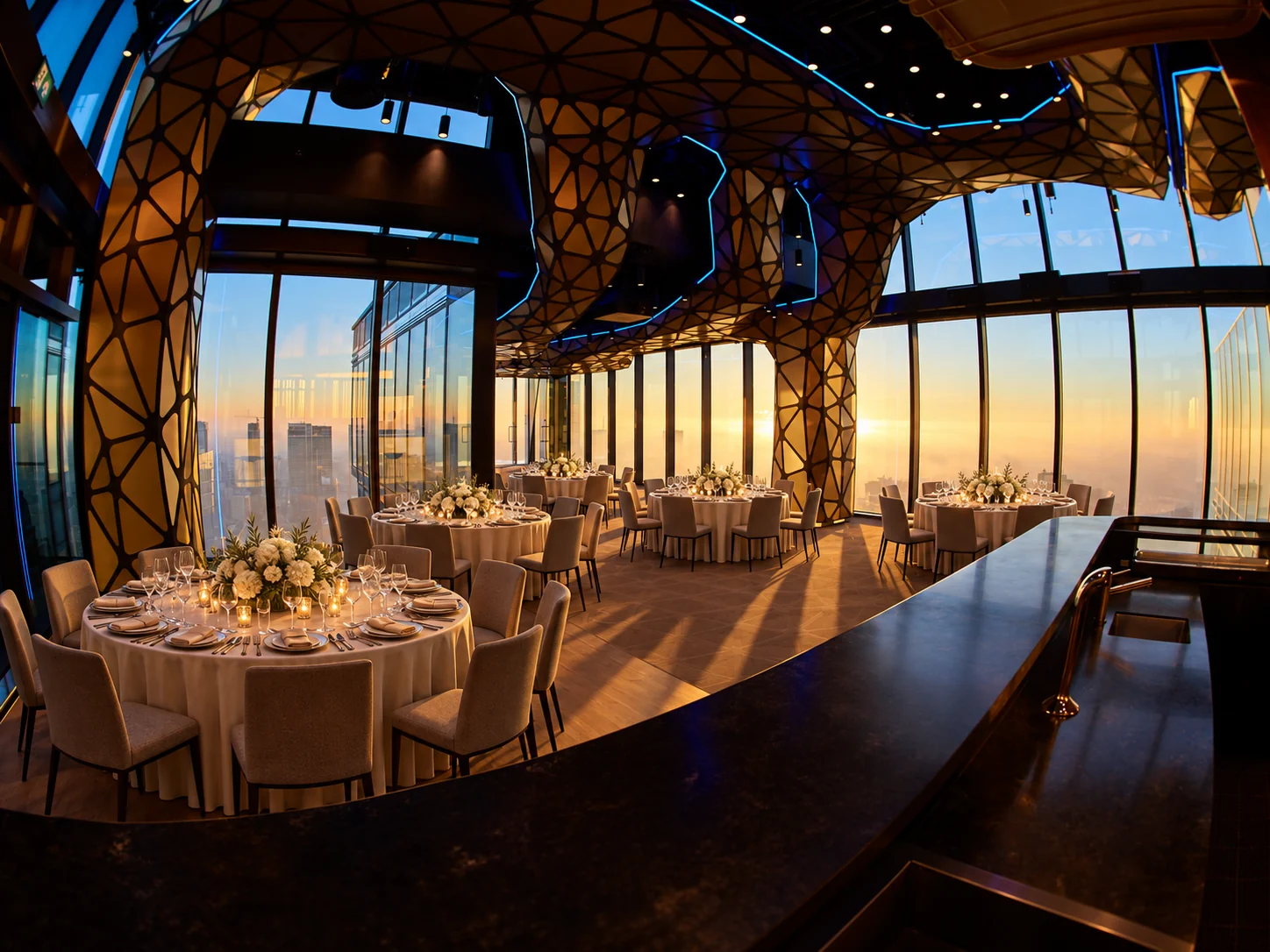 Elegantly set tables at Skyfall Warsaw overlooking the city at sunset